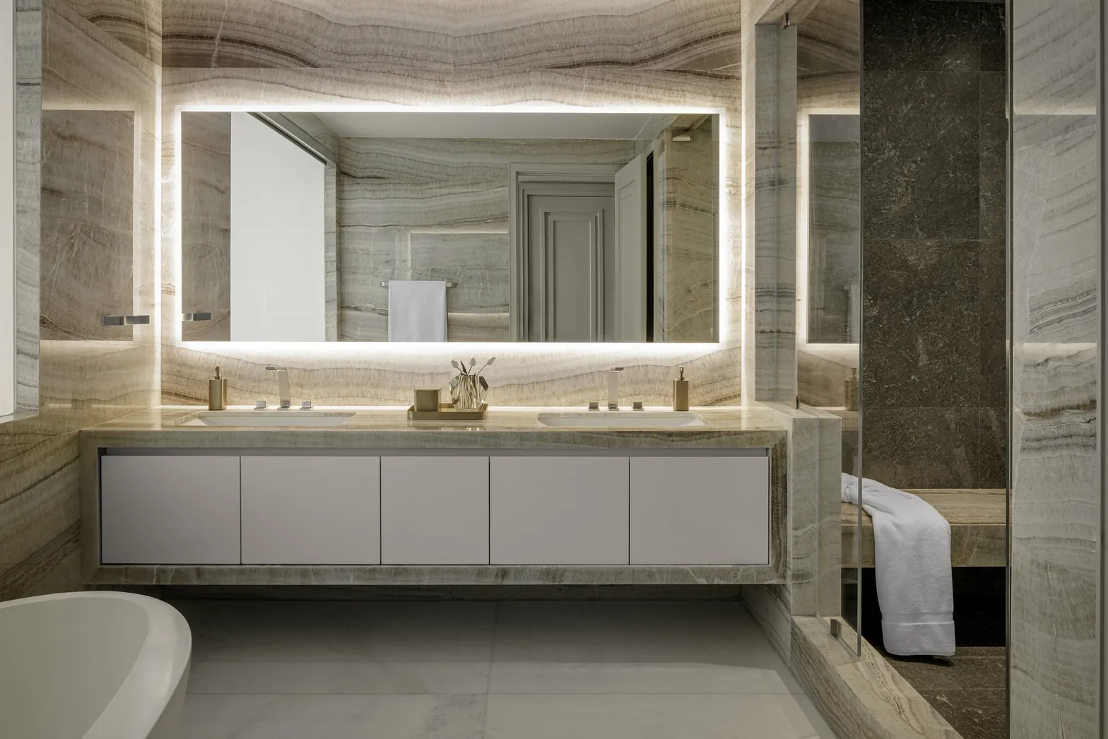 Master bathroom in backlit onyx with floating double vanity and illuminated mirror, Acqualina 2303, Sunny Isles Beach