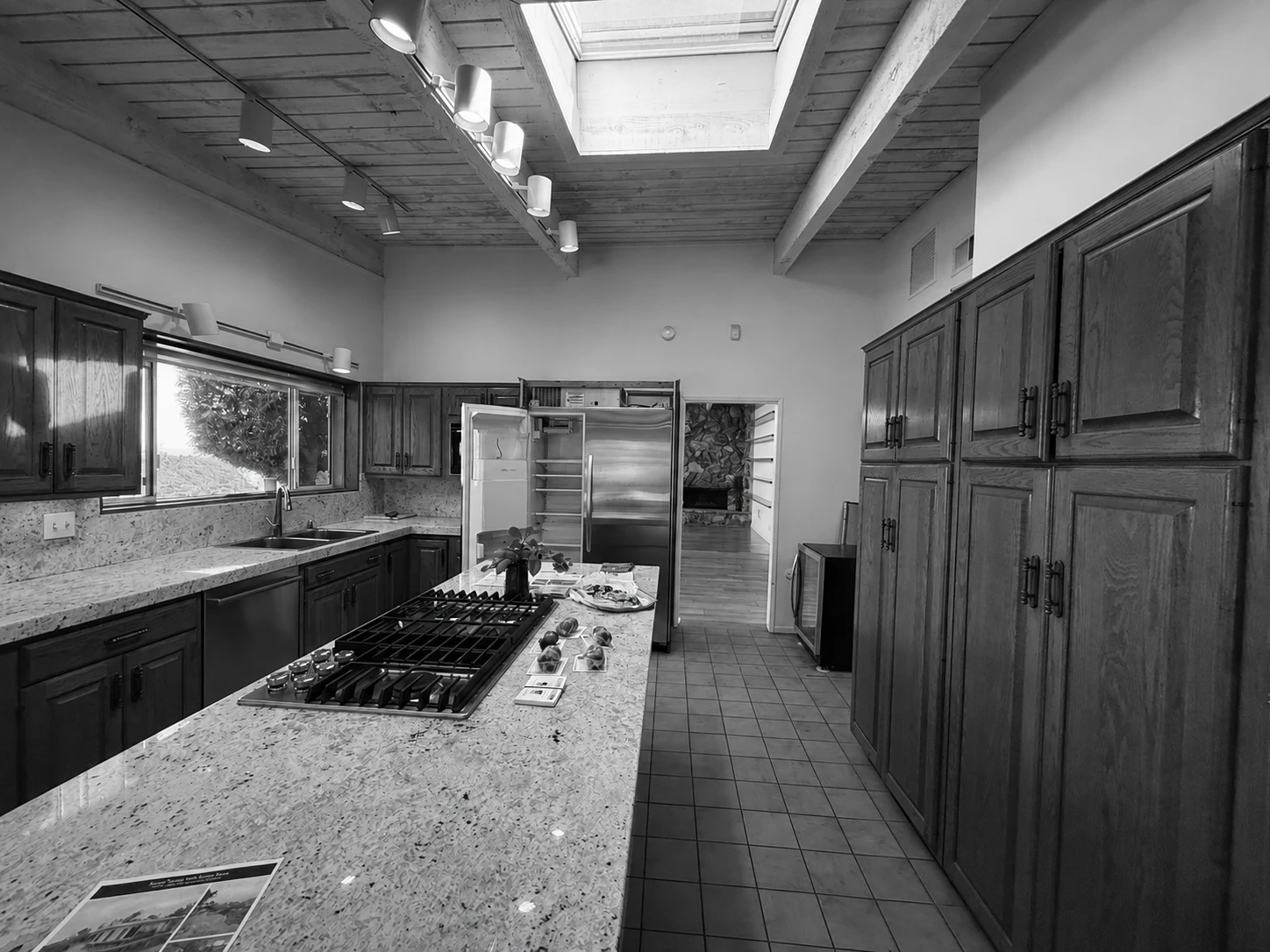West Ridge Residence before renovation — living room and terrace doors
